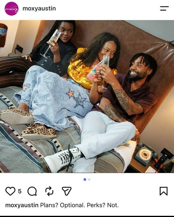 Client Posts — @moxyaustin post of three guests toasting on a guest room bed with the room's rotary phone alongside