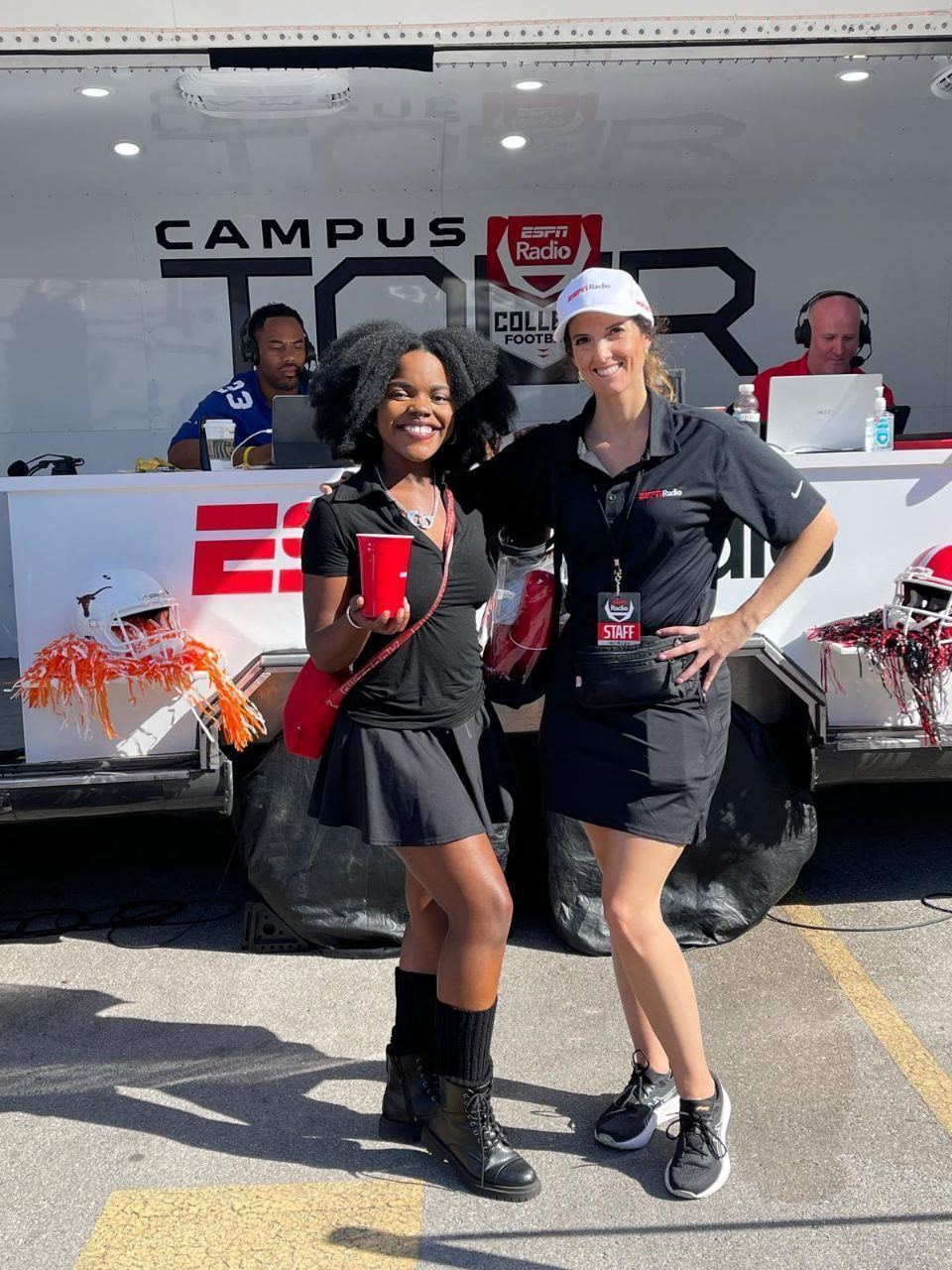 Events — ESPN Radio Campus Tour college football activation with two ambassadors posing at the live broadcast trailer