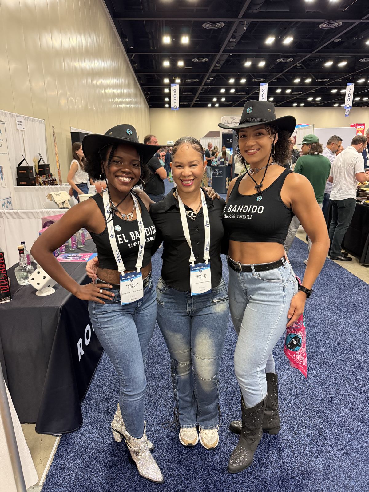 Events — El Bandido Yankee Tequila ambassadors in branded tanks and black cowboy hats on the convention floor