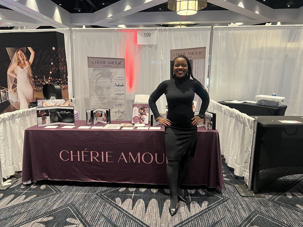 Events — Chérie Amour Lingerie booth 109 with brand ambassador, Agent Provocateur and Aubade banner, and boudoir sample albums