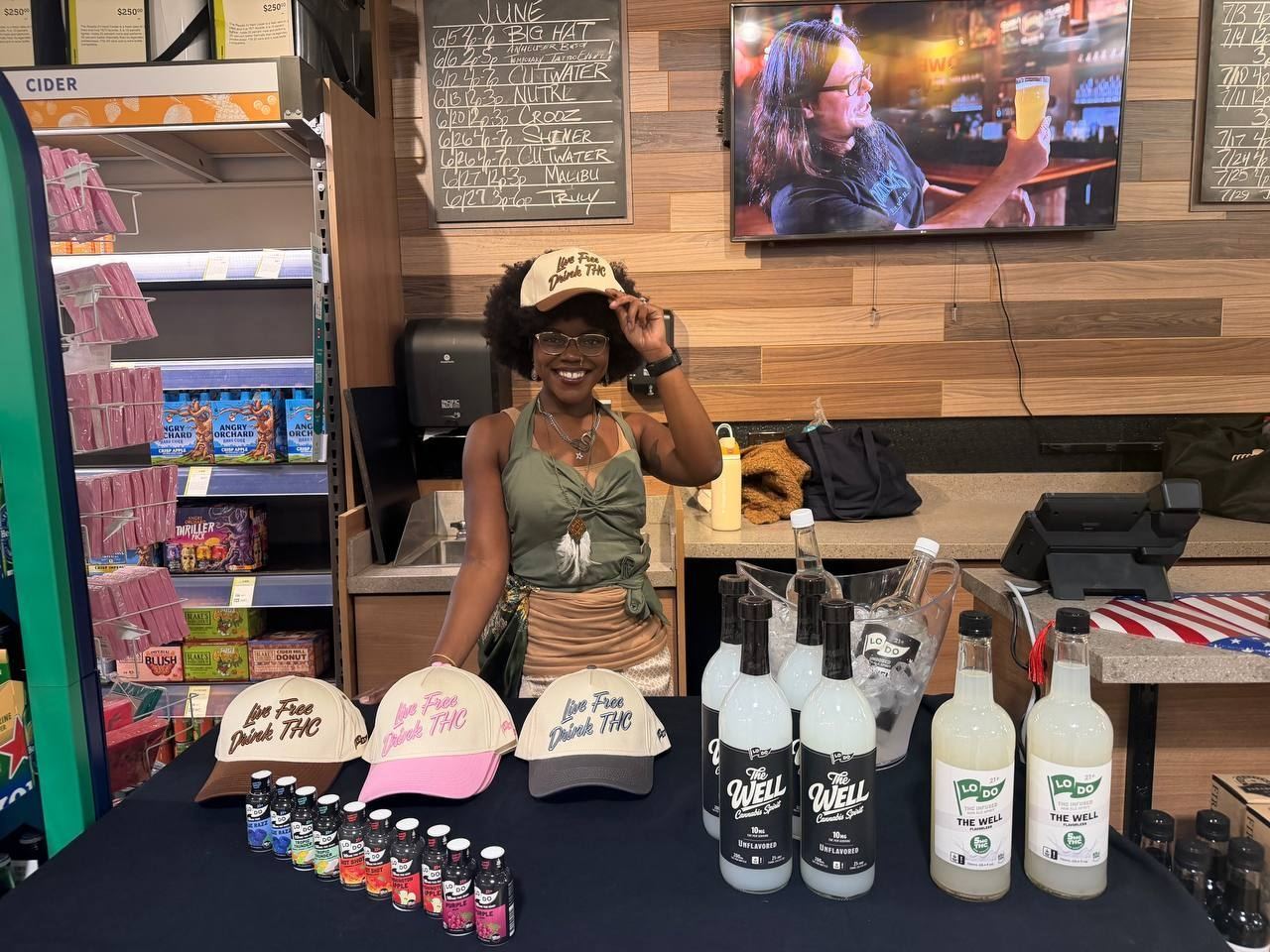On-Site Activations — LoDo THC tasting event with brand ambassador in afro and Live Free Drink THC cap