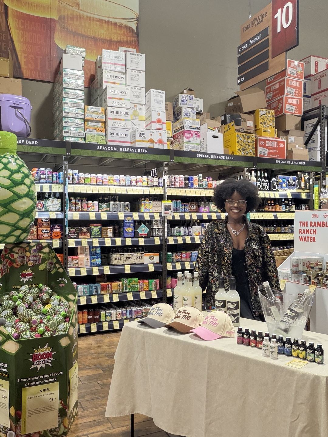 On-Site Activations — Total Wine tasting station with LoDo The Well bottles, Live Free Drink THC caps, and Rambler Ranch Water display
