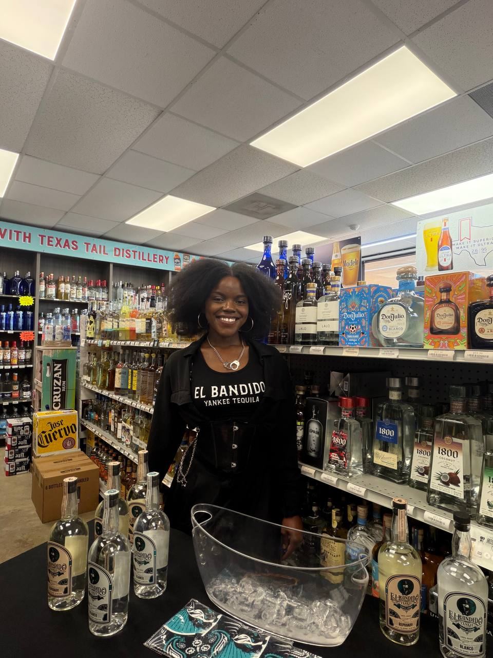 On-Site Activations — El Bandido Yankee Tequila ambassador at a liquor store tasting table with Blanco and Reposado bottles chilling on ice